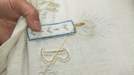 A-person-embroidering-a-piece-of-fabric