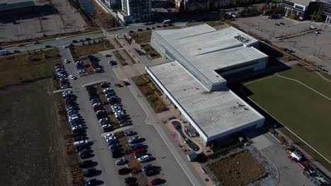Aerial-shot-of-the-parking-lot-by-the-YMCA-sports-facility-in-Quarry-Park-community-in-Calgary