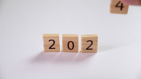 Making-a-countdown-for-the-coming-new-year-2024-using-the-numbers-etched-on-wooden-tiles