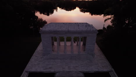 Aerial-view-of-a-sunset-over-the-Roger-Williams-Park-music-temple-and-the-lake-in-the-background