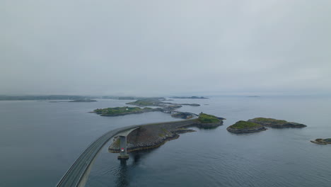 Drone-pullback-view-over-Storseisundet-bridge-along-famous-Atlantic-Ocean-Road