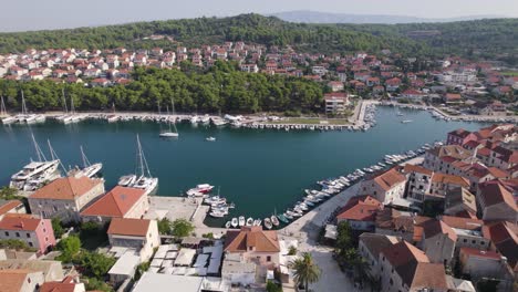 Aerial:-Stari-Grad,-Hvar-Island,-Croatia-showcasing-harbor-and-historic-town