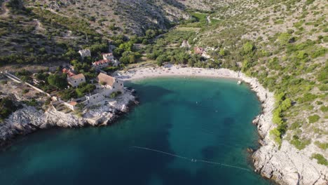 Secluded-paradisiac-beach-bay-of-Dubovica-Hvar-Island,-aerial-drone-shot