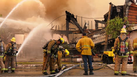 LA-Fire-department-fighting-a-structure-in-flames-in-Los-Angeles,-USA