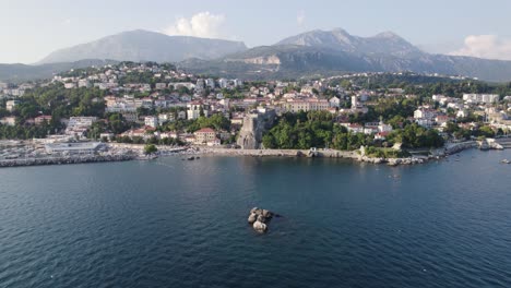 Aerial-view-of-Herceg-Novi,-Montenegro-with-coastal-town-and-mountains