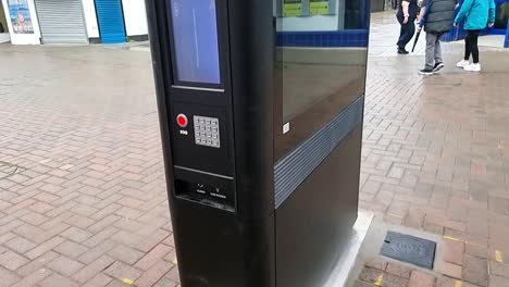 British-telecom-street-hub-touchscreen-information-point-installed-in-urban-town-center,-tilting-upwards