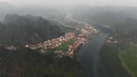Phong-nha-ke-bang-wide-shot-of-the-city-at-Vietnam,-aerial