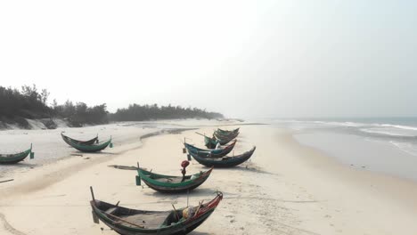 Aerial-shot-of-local-fishing-boats-on-beach-at-Vietnam