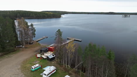 Camping-Vans-Parked-On-The-Lake-Shore-During-Autumn-In-Sweden