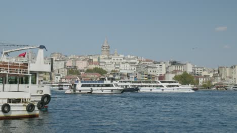Passenger-ferry-boats-sail-Golden-Horn-Eminonu-pier-Istanbul-Galata-skyline