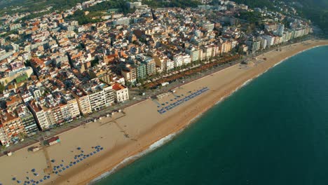 Lloret-De-Mar,-from-the-air-square,-with-few-people-aerial-views