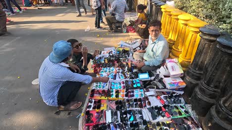 A-shopkeeper-is-selling-goggles-glasses-on-the-street-road