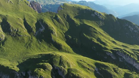 Aerial-view-of-the-lush-green-slopes-of-the-Dolomites-with-undulating-terrain