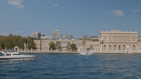 Leisure-boats-cruise-Bosphorus-with-Dolmabahce-palace-backdrop