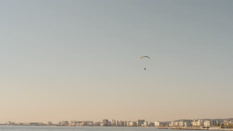 Paraglider-Paragliding-Over-Beach-In-Vlore,-Albania