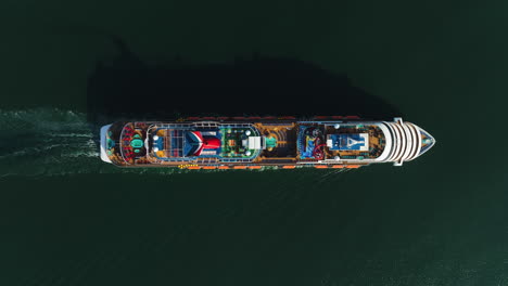 Aerial-birds-eye-view-above-a-sunlit-cruise-liner-driving-on-the-Gulf-of-Mexico