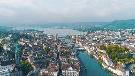 Wide-Panoramic-Zurich-Switzerland-Sweeping-Over-City-Reformation-History-Aerial-Cinematic-Drone