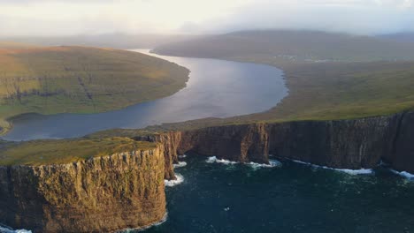 Far-range-drone-footage-of-the-Leitisvatn-Lake,-aka-the-Floating-Lake,-on-the-Vagar-island-in-the-Faroe-Islands
