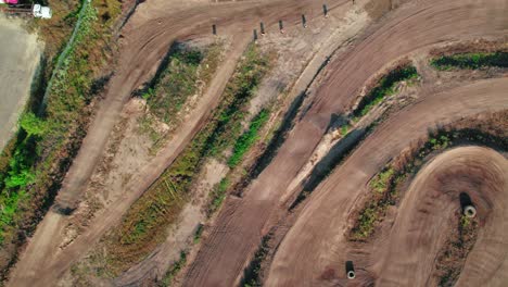 Aerial-drone-top-down-shot-above-a-motocross-circuit-reveling-the-track-design