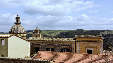 Timelapse-of-the-historic-Castello-di-Ragusa-Ibla-built-in-baroque-architecture-during-a-cultural-trip-through-the-Sicilian-city-of-ragusa,-italy-with-moving-clouds-on-a-summer-day