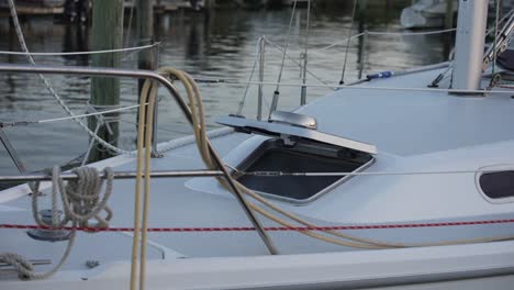 close-up-shot-of-an-open-hatch-on-a-sailboat-docked-at-a-marina