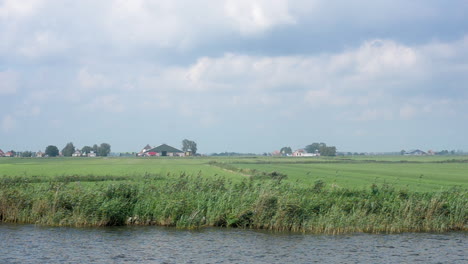 Dutch-dairy-farm-land,-TRACKING-SHOT