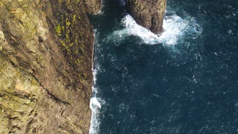 Slow-drone-footage-of-a-very-steep-cliff-on-the-Vagar-island-in-the-Faroe-Islands