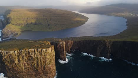 Very-far-approaching-drone-footage-of-the-Leitisvatn-Lake,-aka-the-Floating-Lake,-on-the-Vagar-island-in-the-Faroe-Islands