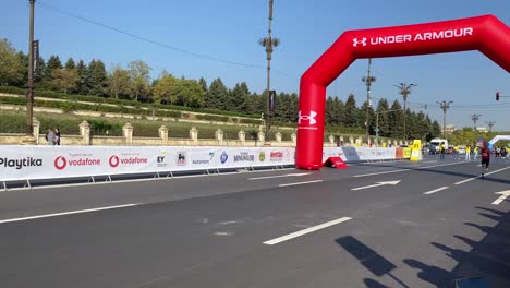 Elite-athletes-run-below-inflatable-arch-as-they-sprint-to-the-finish-of-the-race