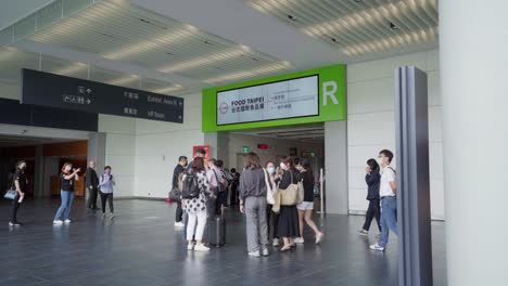 Timelapse-of-Crowds-of-People-Moving-Around-Exhibition-Hall-Entrance