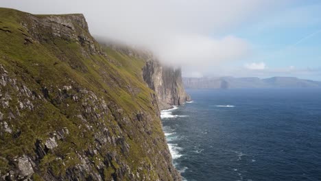 Distant-drone-footage-of-the-Witch-Finger-at-Sandavagur-on-the-Vagar-island-in-the-Faroe-Islands