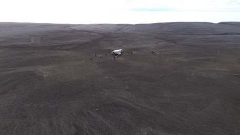 Aerial-shot-of-the-Sólheimasandur-DC3-plane-crash-site-surrounded-with-black-volcanic-sand