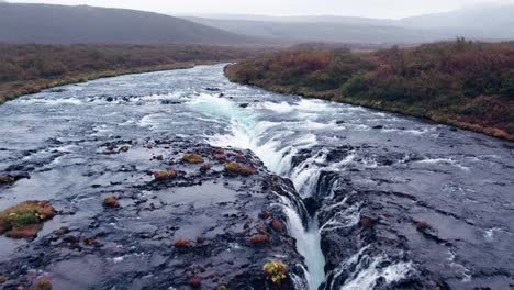 Aerial:-Close-reverse-reveal-of-Bruarfoss-cascading-waterfall-off-the-golden-circle-in-southern-Iceland