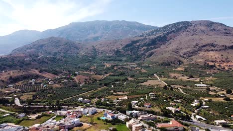 Magical-Crete-island-landscape-with-mountains-and-town,-aerial-view