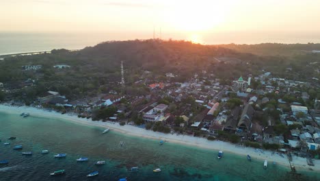 Aerial-over-Gili-Trawangan-Beach,-Indonesia,-an-slice-of-tropical-heaven-that-beckons-travelers-with-its-tranquil-beauty-and-serene-charm