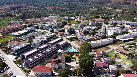 Bright-town-center-of-Georgioupoli-in-Crete-island,-aerial-view