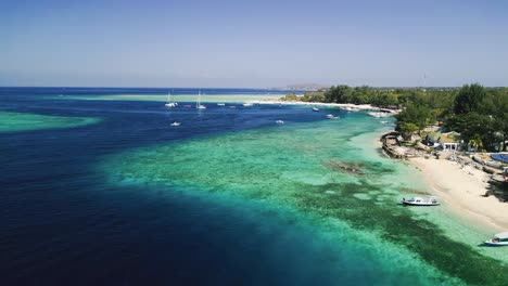 Aerial-of-Gili-Air-Beach-South,-located-on-the-idyllic-island-of-Gili-Air-in-Indonesia,-is-a-true-tropical-paradise-that-captures-the-essence-of-serene-island-life