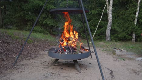 campfire-grill-or-Fire-pit-grill-with-burning-bright-wood-in-the-firebox
