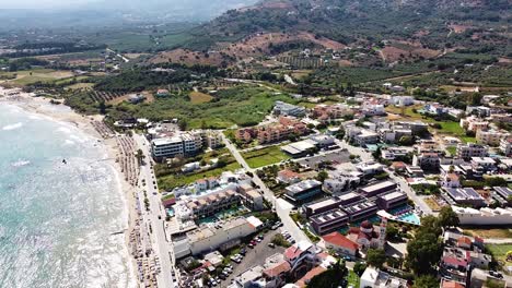Exotic-township-on-coastline-of-Crete-island,-aerial-drone-view