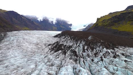 Aerial-establishing-shot-of-the-beautiful-Skaftafell-Glacier-ridges-within-the-valley