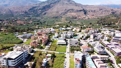 Mountains-and-town-of-Georgioupoli-in-Greece,-aerial-view