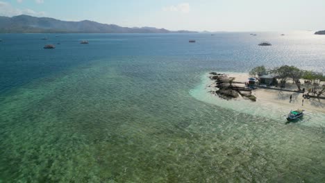 Aerial-of-Gili-Kedis,-a-charming-little-gem-located-in-the-Sekotong-area-of-Indonesia,-perfect-destination-to-enjoy-quality-time-with-friends-and-family