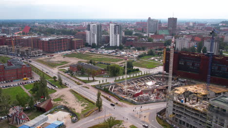 A-panoramic-view-of-commercial-buildings-and-expansive-construction-sites-can-be-seen-near-the-center-of-Gdansk,-Poland