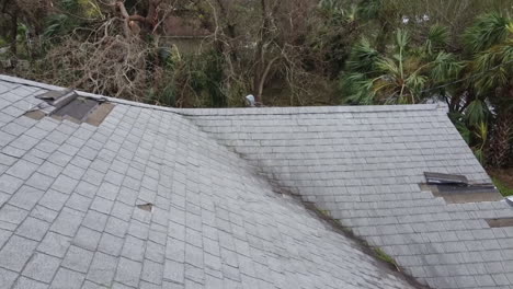 Water-damage-to-the-house-roof-from-strong-hurricane-storm-winds-pending-insurance-claim