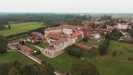 Drone-shot-abbazia-Morimondo-backward-moment-in-Lombardia-plain