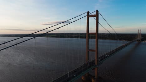 Sunset's-enchantment:-Humber-Bridge-shines-as-an-aerial-drone-records-the-fluid-movements-of-cars-on-its-majestic-expanse