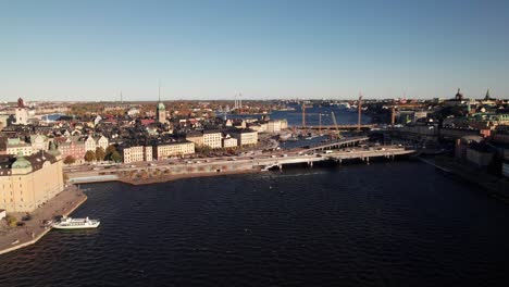 Centralbron-Bridge-in-Stockholm,-Sweden-on-Lake-Mälaren,-4K-drone-shot