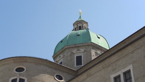Green-Rooftop-Dome-of-Salzburg-Cathedral-with-Golden-Cross-on-Top-of-It