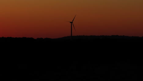 Captivating-sunset-drone-footage-featuring-a-wind-turbine
