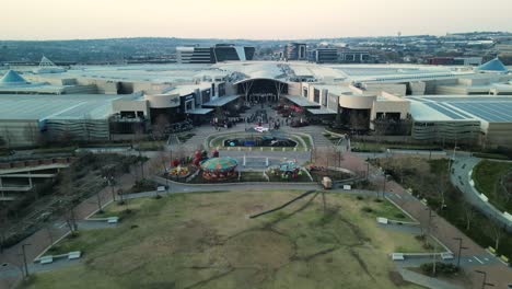 Forward-moving-drone-shot-of-Town-Square,-Mall-of-Africa,-Midrand,-South-Africa